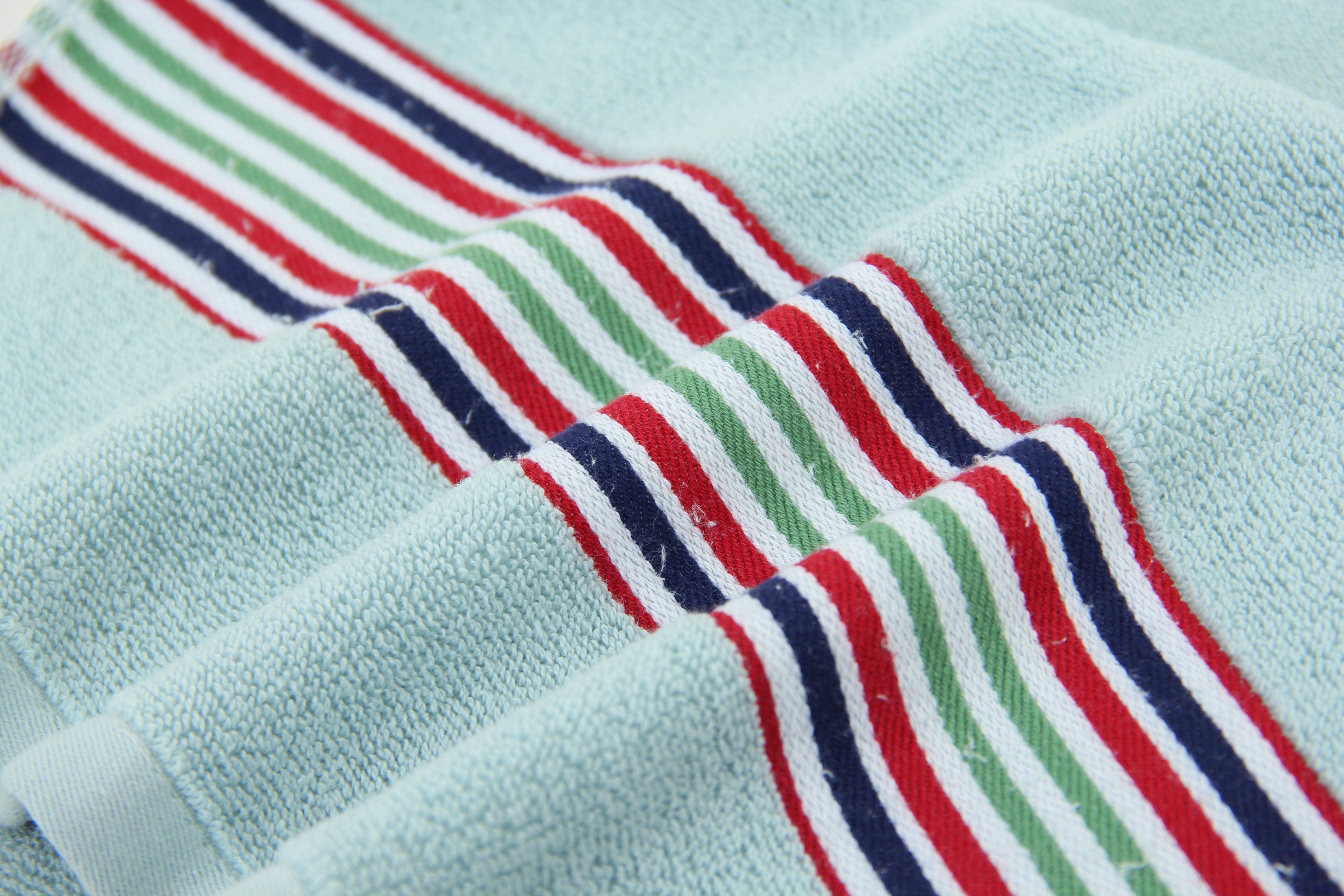 Folded striped cyan towel